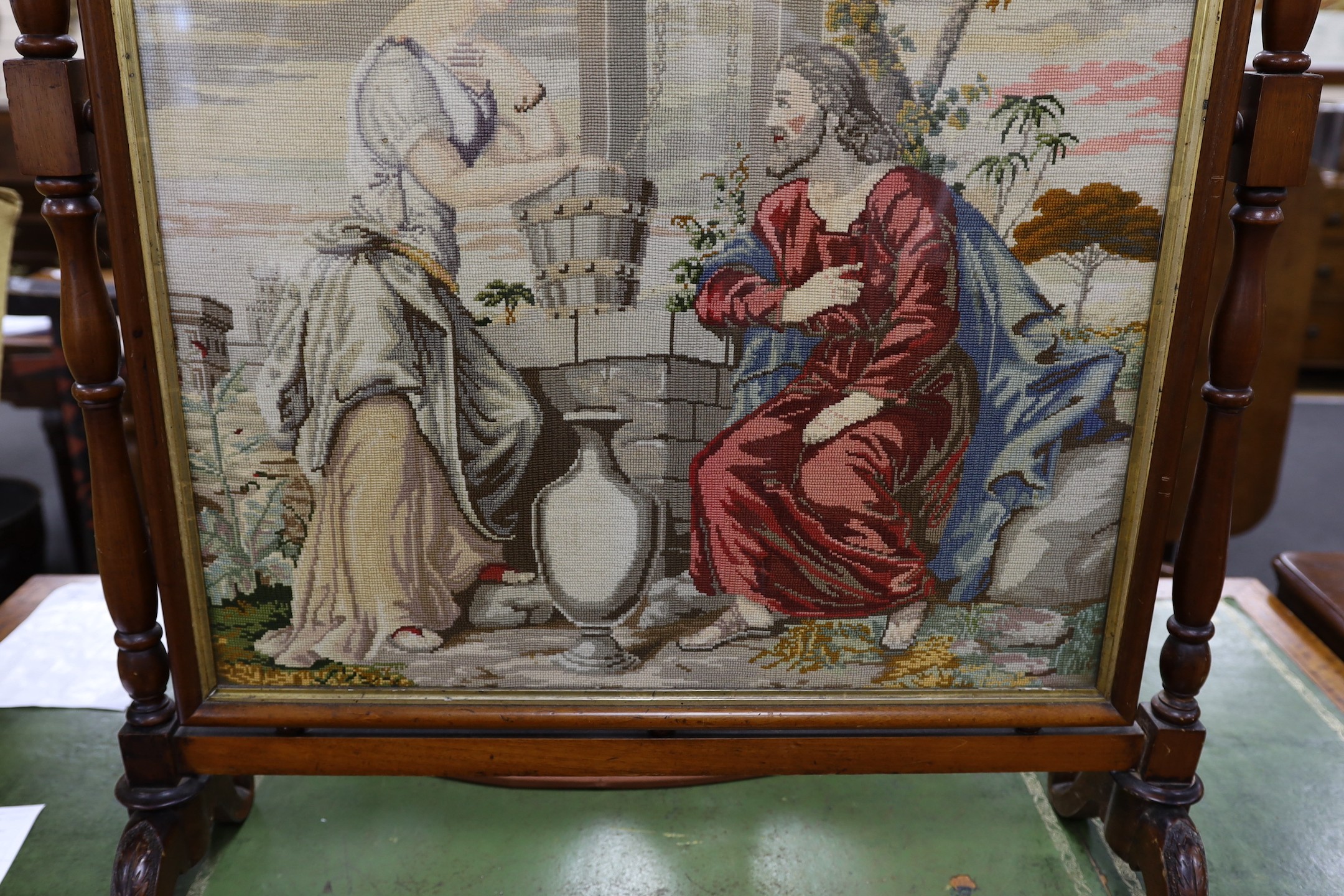 A large Victorian mahogany framed needlepoint firescreen, height 132.5cm high, width 86cm